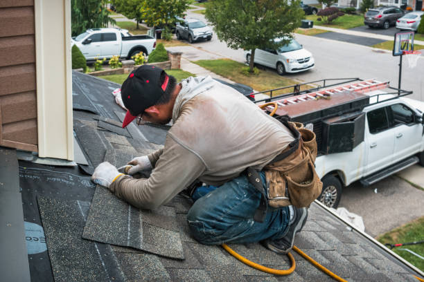 Professional Roofing technician working in Dola, OH